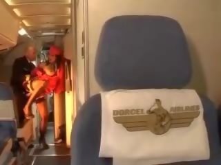 Oversexed stewardess rides a johnson inside both holes