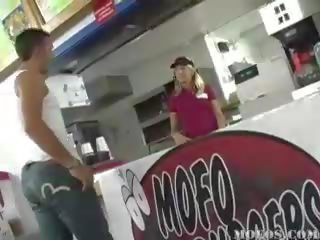 Sexy fast food worker gets down on her knees to blow two youngsters