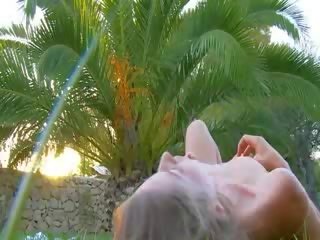 Fingers in soft pussy in the garden