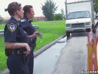 Female cops pull over ireng suspect and suck his shaft